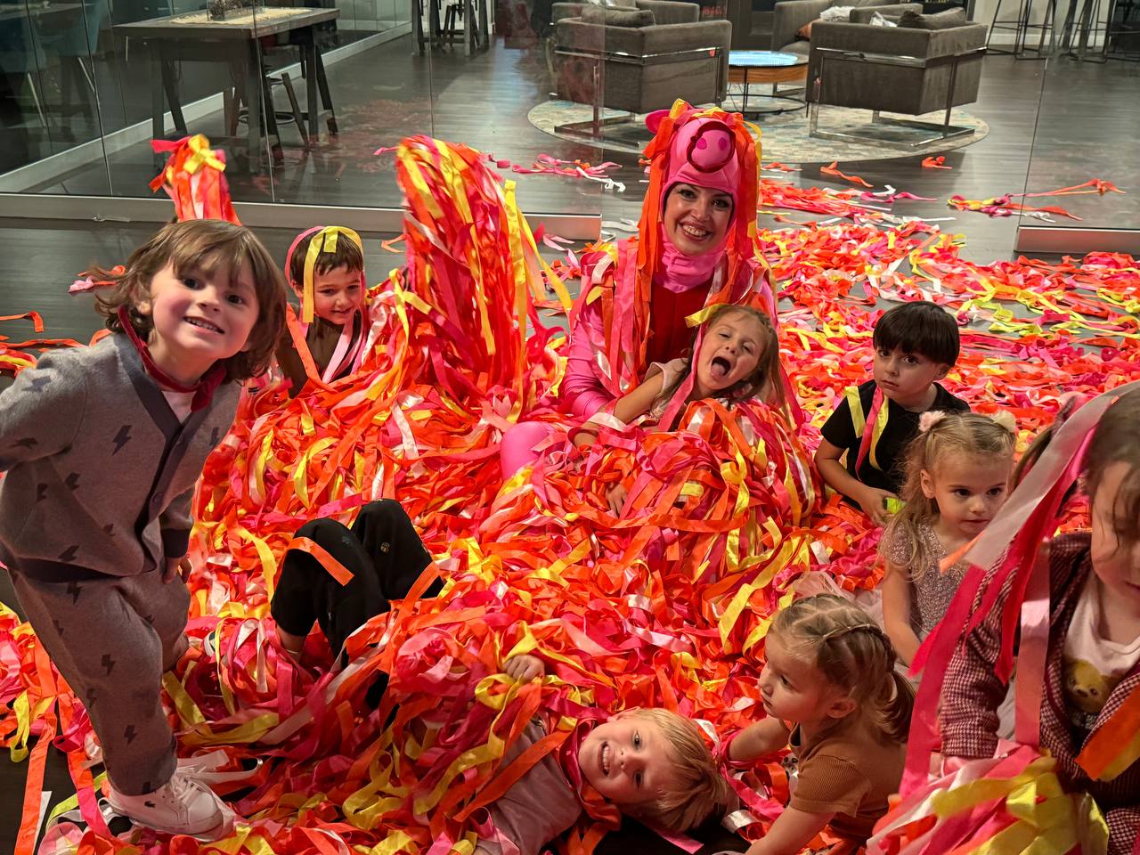 Peppa Pig character entertainer with ribbons at toddler themed birthday party