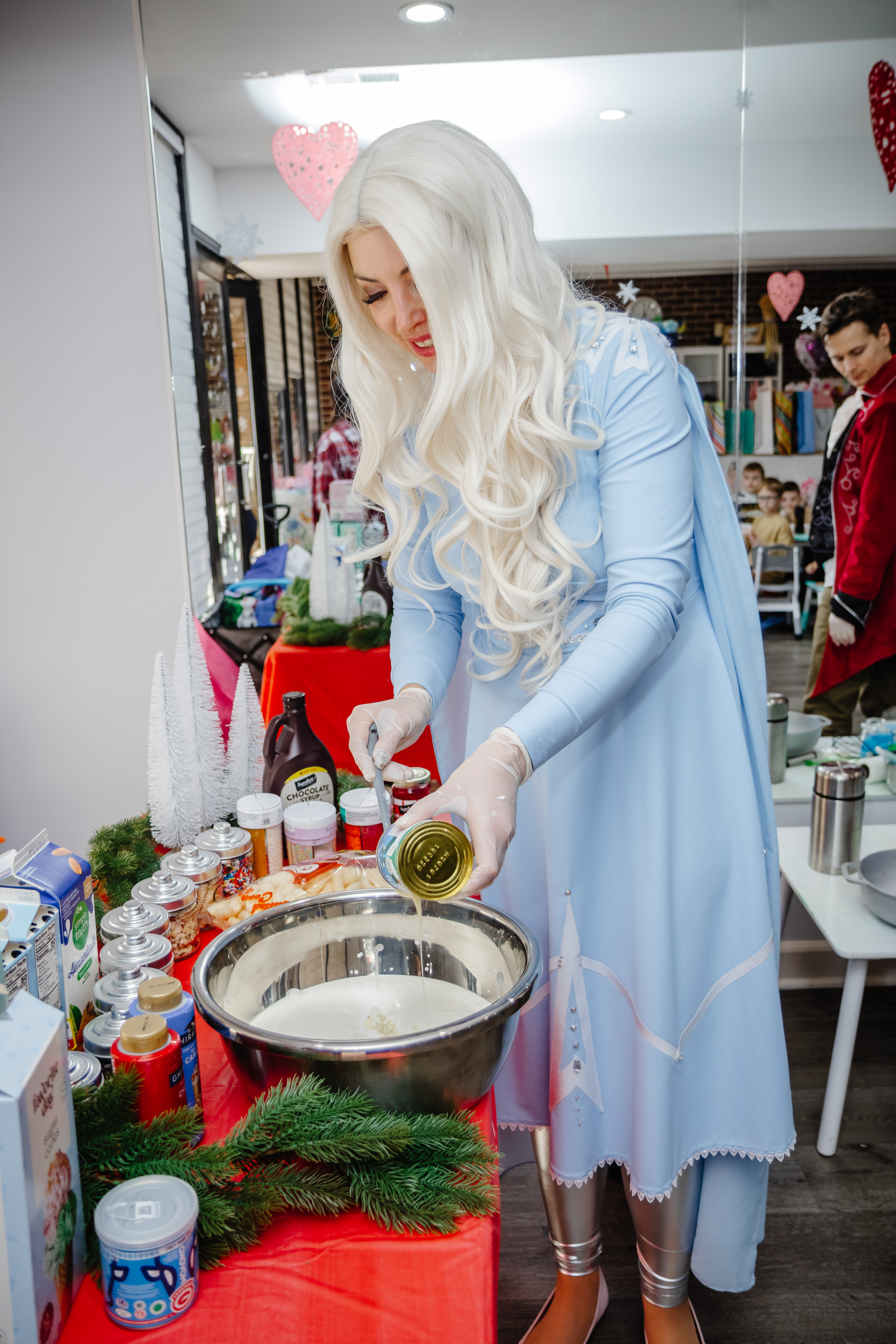 Elsa character preparing ingredients at a kids cooking activity