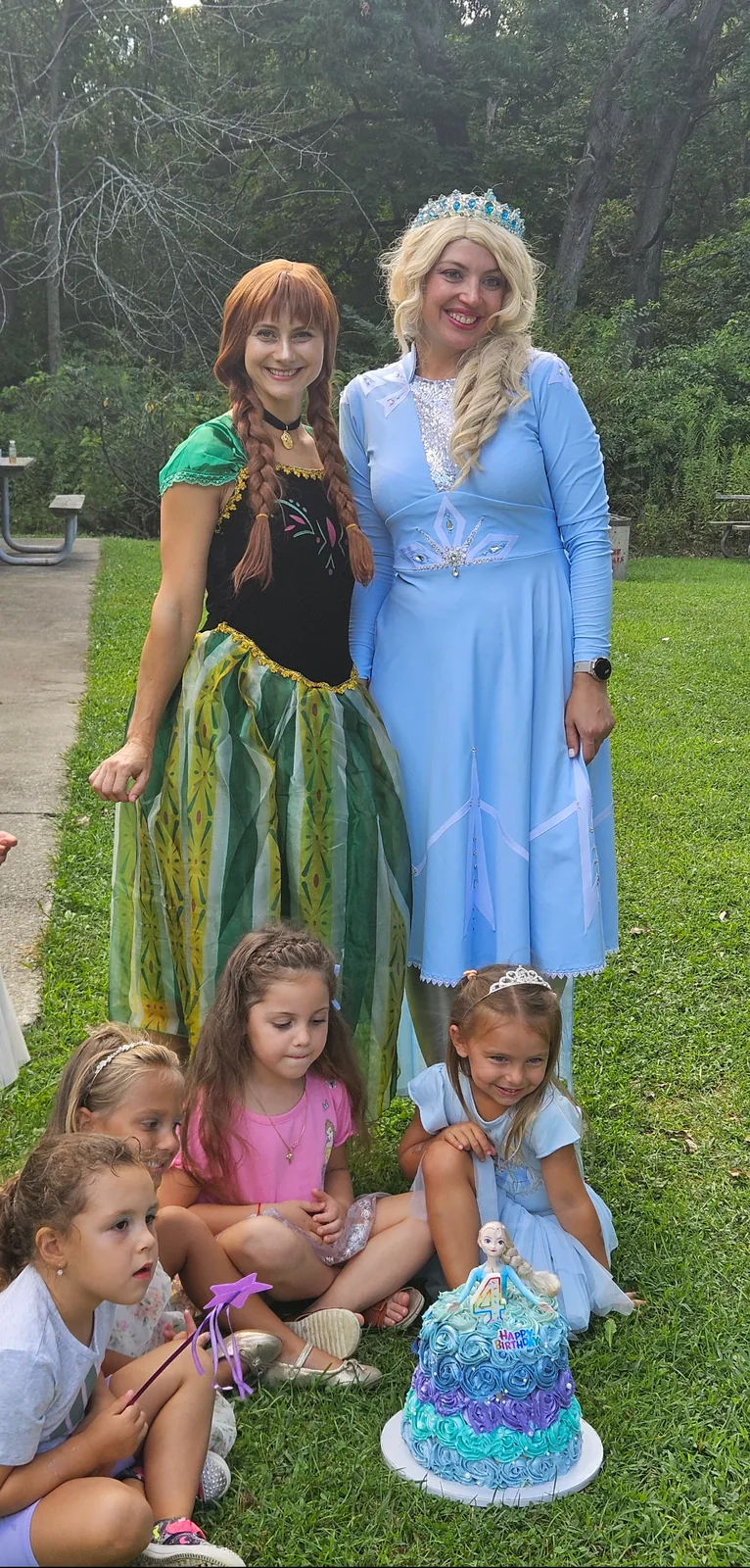 Elsa and Anna entertainers with children at a Frozen-themed birthday party