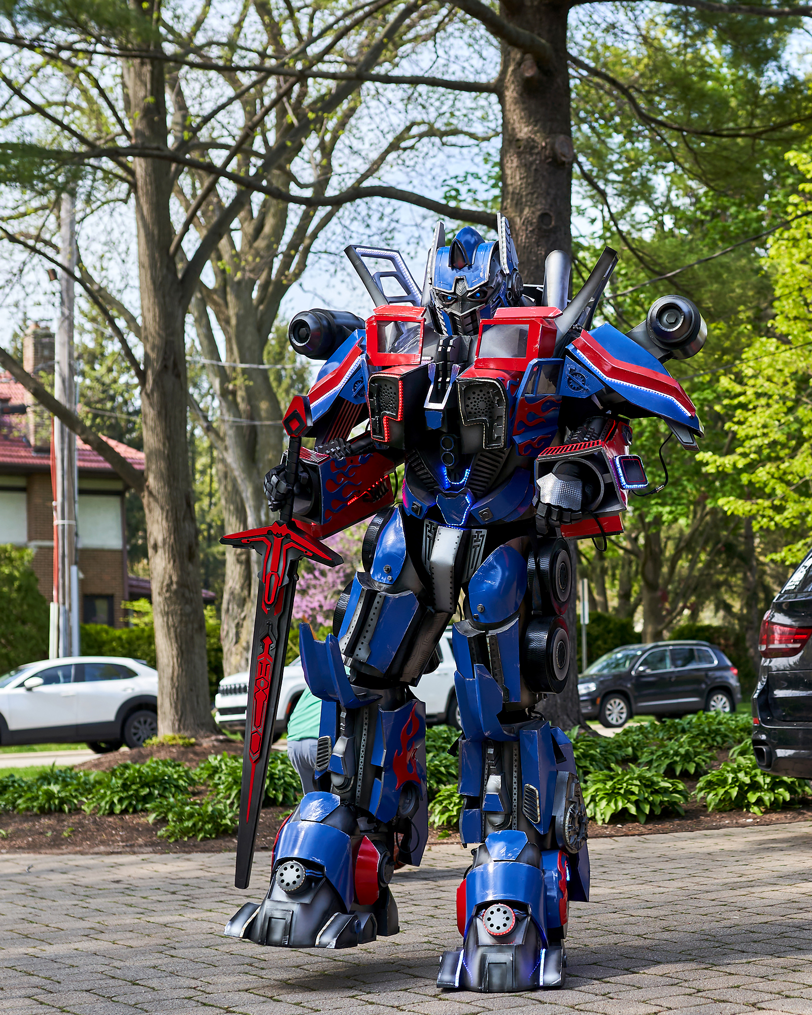 Optimus Prime robot performer posing outdoors at a children's party