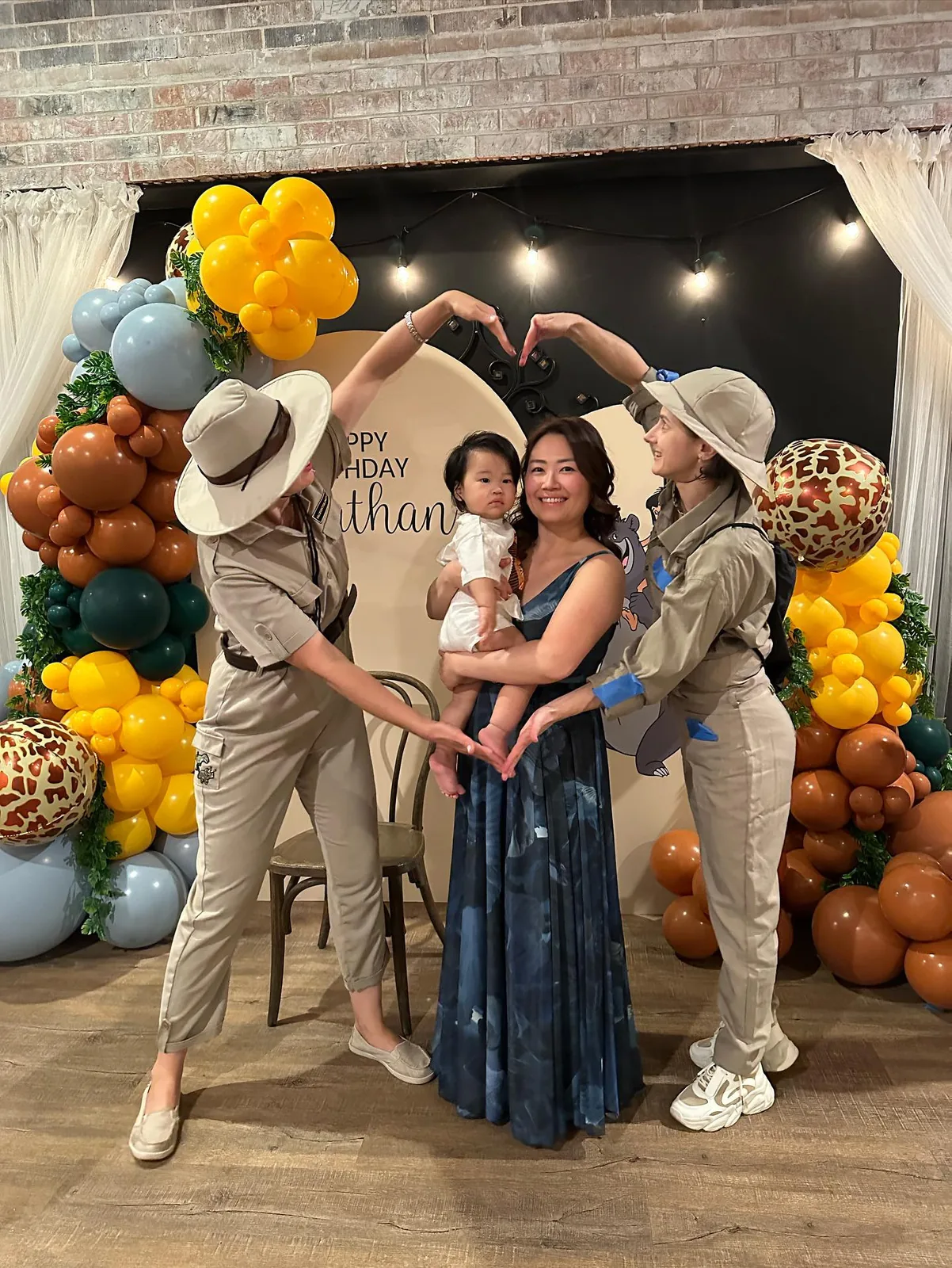 Family photo with a safari entertainer holding a dinosaur puppet